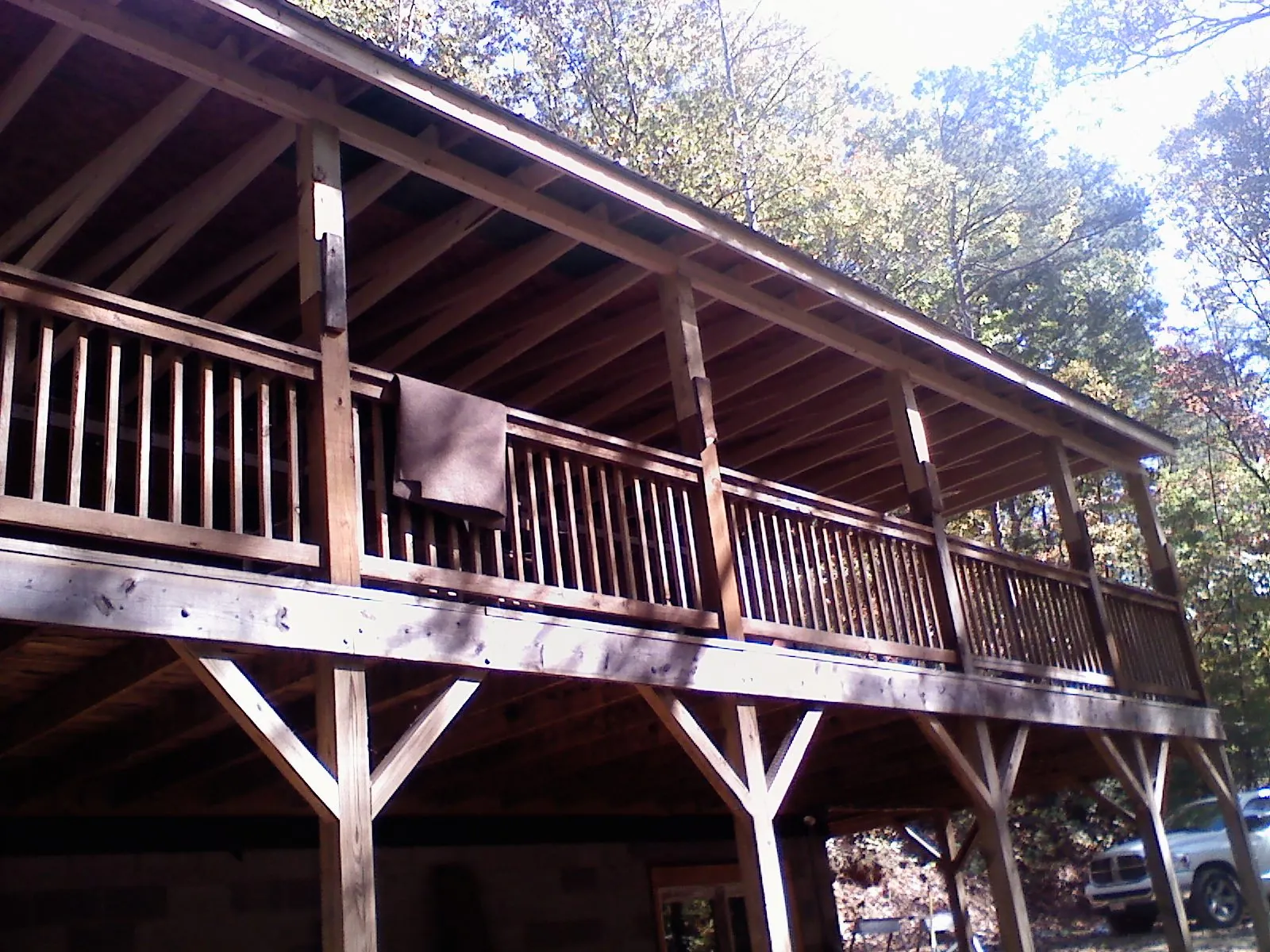 Timber framing under a new elevated porch and deck — Roof Leak Repair in University Place by Roofing Brothers